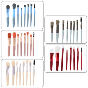 8-piece mini portable makeup brush set in five assorted macaron colors on white background