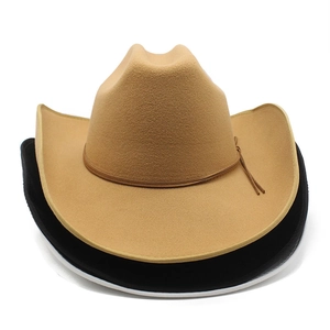 Detail showing stacked light camel and black felt cowboy hats with fine leather cords