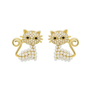 Detailed close-up of cat stud earrings with white pearls and sparkling crystal inlay