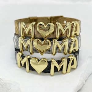 Detail view of MAMA letter charms on gold, silver, and black mesh steel bracelets