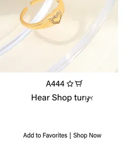 Macro detail of golden heart ring featuring brushed metal texture and micro zircon stones