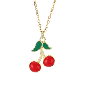 Minimalist gold stainless steel necklace with red enamel cherry pendant on white background