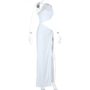 Detail of white one-shoulder maxi dress featuring waist cutout and high side slit