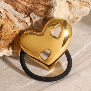 Minimalist 18K gold hollow heart hair tie on a natural stone background with high polish finish