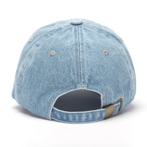 Detail view of washed denim baseball cap with adjustable metal buckle and strap