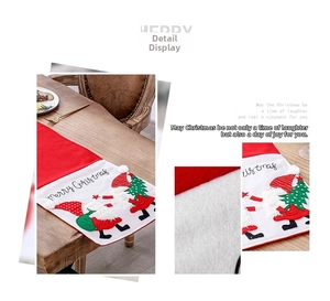 Detail of red and white Christmas gnome table runner with Merry Christmas embroidery