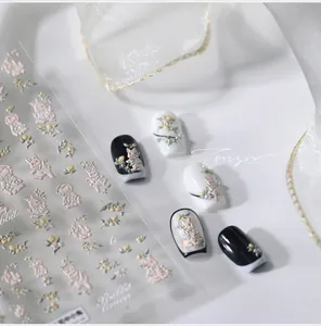 Detail of 3D embossed nail stickers with cute rabbit, lemon and floral patterns