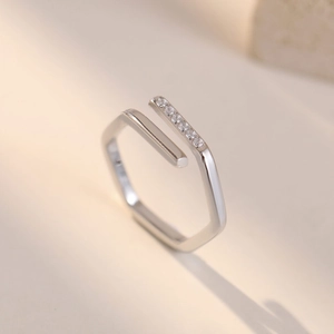 Minimalist geometric hexagonal open ring with small round diamonds in silver finish