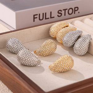 Elegant teardrop pavé diamond stud earrings in gold and silver finish for women