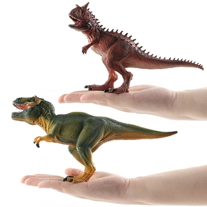 Realistic solid Carnotaurus and Tyrannosaurus dinosaur toy models held in hand