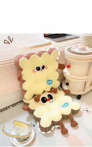 Detail of red and brown plaid cookie chair cushions with cute cartoon faces and star tags