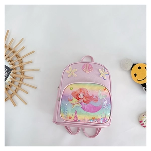 Close-up of pink mermaid backpack with glitter finish and decorative 3D sea elements