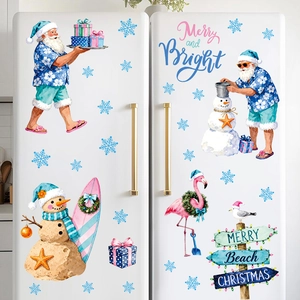 Tropical Santa beach themed Christmas stickers displayed on a white refrigerator