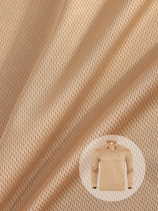 Macro detail of breathable hexagonal mesh fabric on a camel long sleeve polo shirt