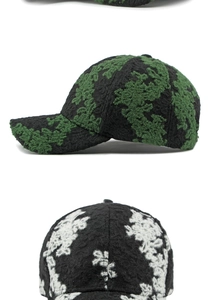 Macro detail of retro jacquard texture and embossed floral patterns on baseball caps