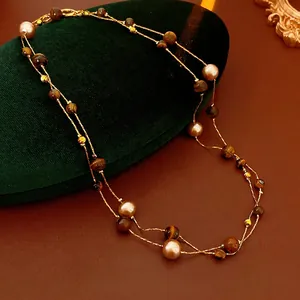 Vintage double-layer tiger eye and pearl necklace with golden chains in retro style