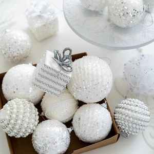 Elegant white Christmas baubles with pearls and silver sequins for tree decoration