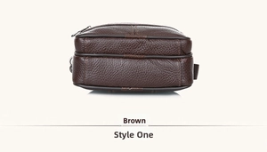Detail of dark brown litchi leather bag with double zippers and D-ring buckle