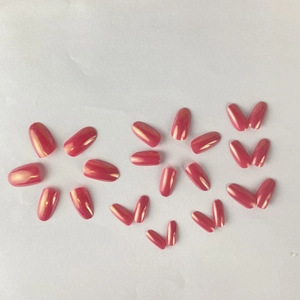 Short oval pink holographic press-on nails arranged in a creative floral layout