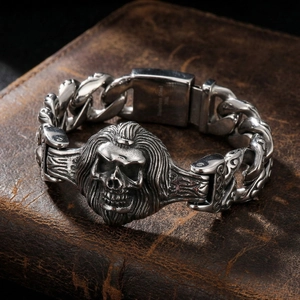 Macro detail of gothic skull bracelet showing 316L stainless steel engraving on leather