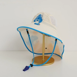 Detail of kids sun hat with neck protection, alligator patch, and whistle drawstring