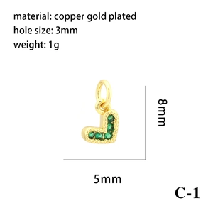 Detail view of 18K gold plated L-shaped pendant with green zircon and size dimensions