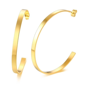 Minimalist wide flat gold C-shaped hoop earrings with a polished metallic finish