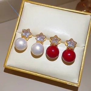 Elegant gold plated star stud earrings with zircon and pearls in red and white colors