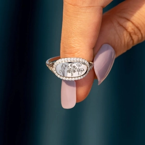 Elegant S925 sterling silver ring featuring floral engraving and shimmering zircon stones