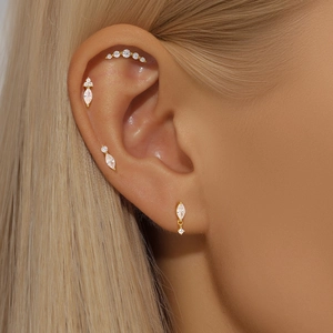 Detail view of gold-plated S925 sterling silver ear studs with marquise-cut cubic zirconia