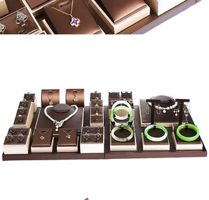 Detailed arrangement of coffee and cream jewelry display set with necklace and ring stands