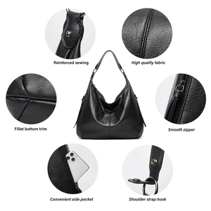 Detail showcase of black leather hobo bag featuring reinforced sewing and smooth zippers
