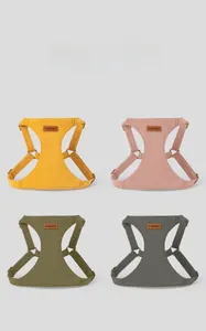Detail view of suede pet harness in four stylish colors with metallic buckles