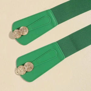 Detail of green elastic waist belts with embossed gold double circle metal buckles