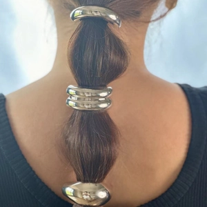 Polished silver U-shaped metal hair cuff clip for elegant ponytail styling
