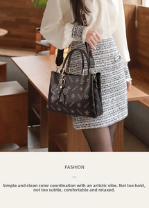 Detail of dark brown leather crossbody bag with MQCKDE print and orange cross pattern