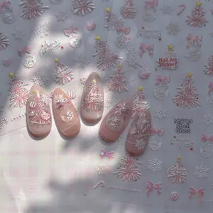 Detail of 3D embossed Christmas nail stickers with pearl shell shine and snowflakes