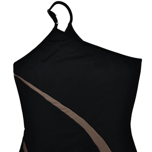 Detailed close-up of a black one-shoulder dress with a brown diagonal stripe and stretch fabric