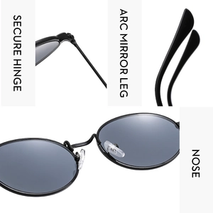 Detail view of oval metal sunglasses showing secure hinges, nose pads, and arc mirror legs