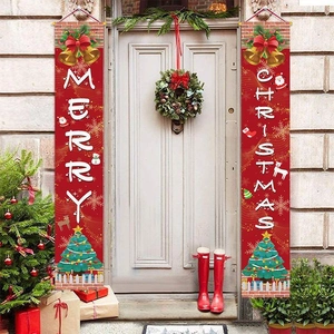 Red Merry Christmas porch banners with holiday patterns on a white wooden door