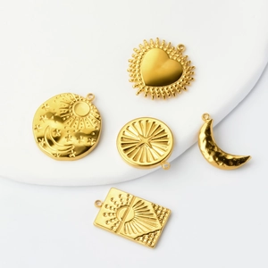 Gold stainless steel celestial pendants featuring sun moon and star motifs on white background
