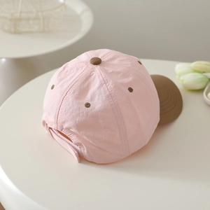 Detailed view of pink and brown quick-dry baseball cap with adjustable back strap