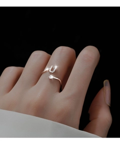Detail of silver open ring with pavé U-shaped charm and star zircon on hand