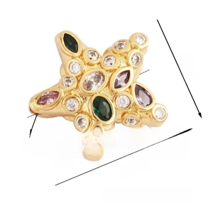 Detailed view of gold-plated star charm with colorful inlaid zircon stones and clear texture
