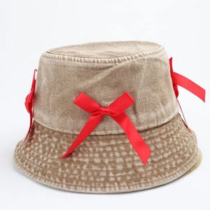Vintage washed denim bucket hat with red silk bows and a flattering sun-shading brim