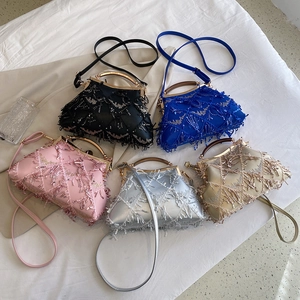 Flat lay of elegant clutch bags in five colors with sparkling sequins and tassels