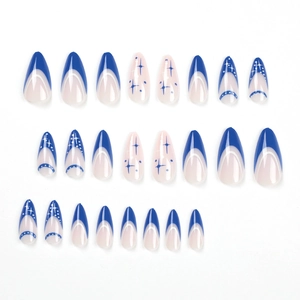 Blue and white French press-on nails with blue starburst patterns in almond shape