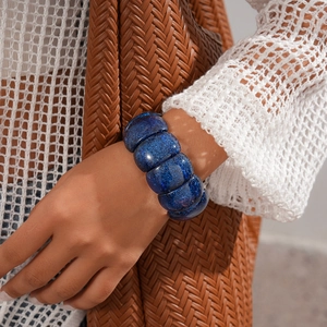 Detailed shot of dark blue glitter acrylic geometric chunky bracelet on wrist