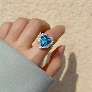 Adjustable silver ring with heart-shaped ocean blue crystal and pavé set small diamonds