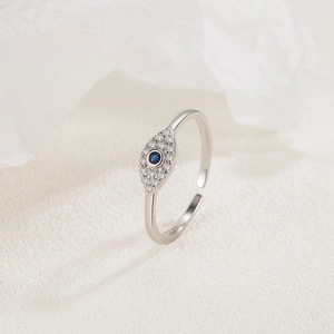 Detailed macro shot of S925 sterling silver evil eye ring with blue zircon inlay